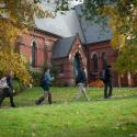 Students walking past the exterior of Sage Chapel.