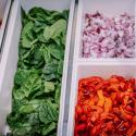 Salad bar with spinach, roasted red peppers, and so much more!
